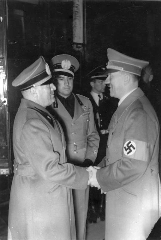 Adolf Hitler greets Benito Mussolini and Galeazzo Ciano in Munich's station at their arrival before the Munich conference